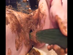 Cucumber got used to pull the shit out of lady's ass